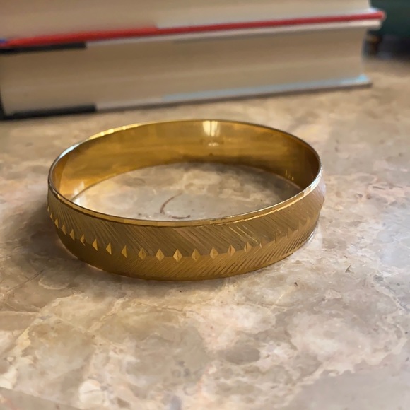 Monet Brushed Goldtone bangle bracelet diamond cut